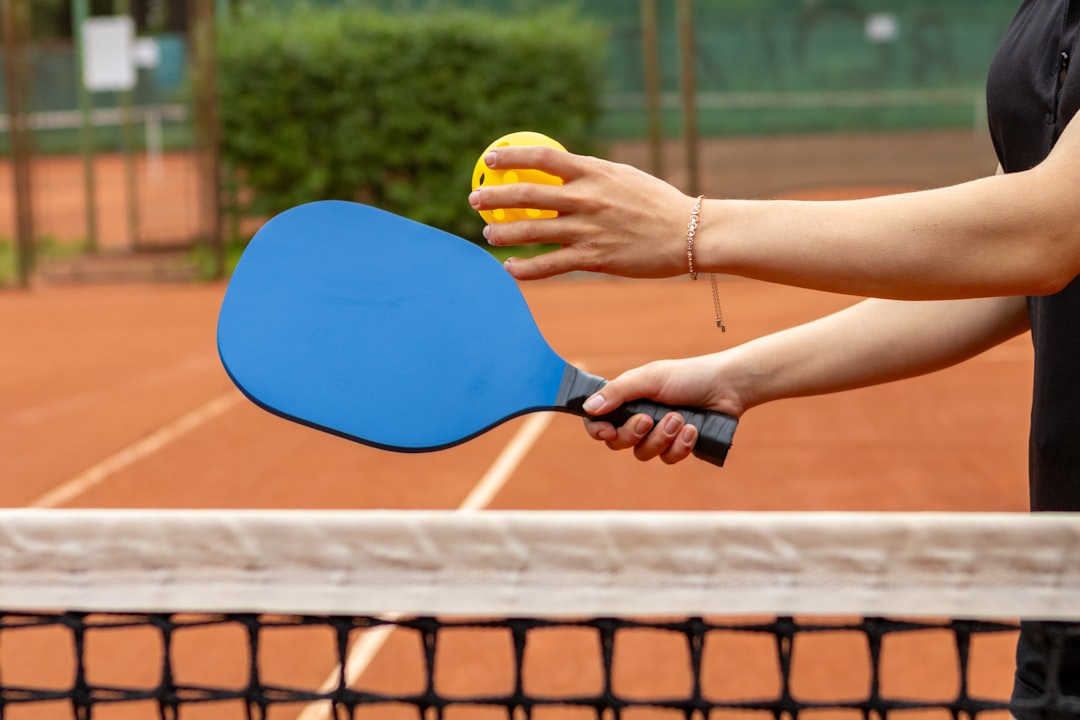 Senior player demonstrating pickleball basics